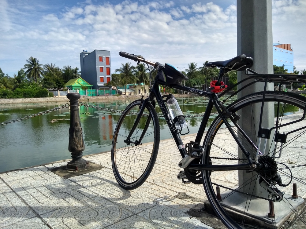 My bicycle, newly assembled, at a decorative fishing lake in Ha Tien. 