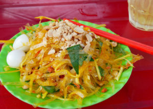 Banh Trang Tron, a street food dish popular in Vietnam, is made with shredded rice paper and green mango.