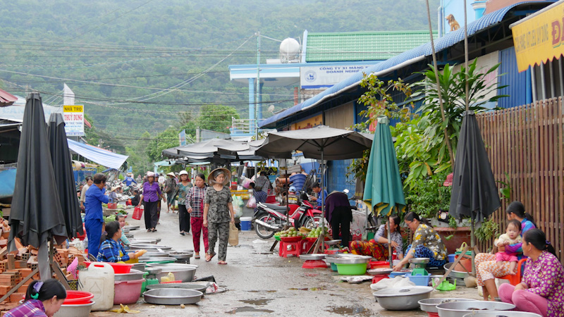 Ladies stroll through the morning market at Ba Chuc, a small town in southern Vietnam.