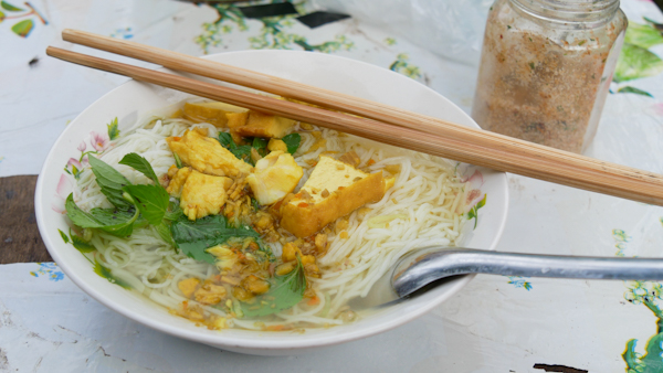 Rustic Bun Ca (fish noodles), served with peanuts and tofu