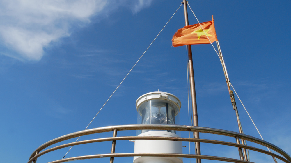 Vietnamese flag flies at Nui Nai lighthouse.