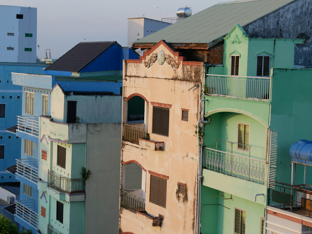 Colourful shop houses light up with the afternoon sun at Ha Tien. 