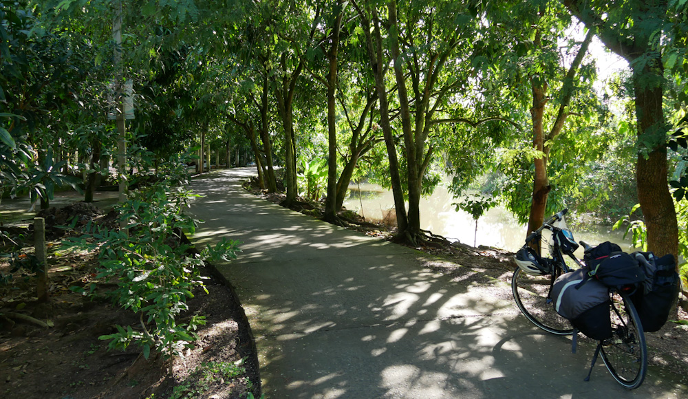 Bicycle on a smooth concrete canal path near Cao Lanh