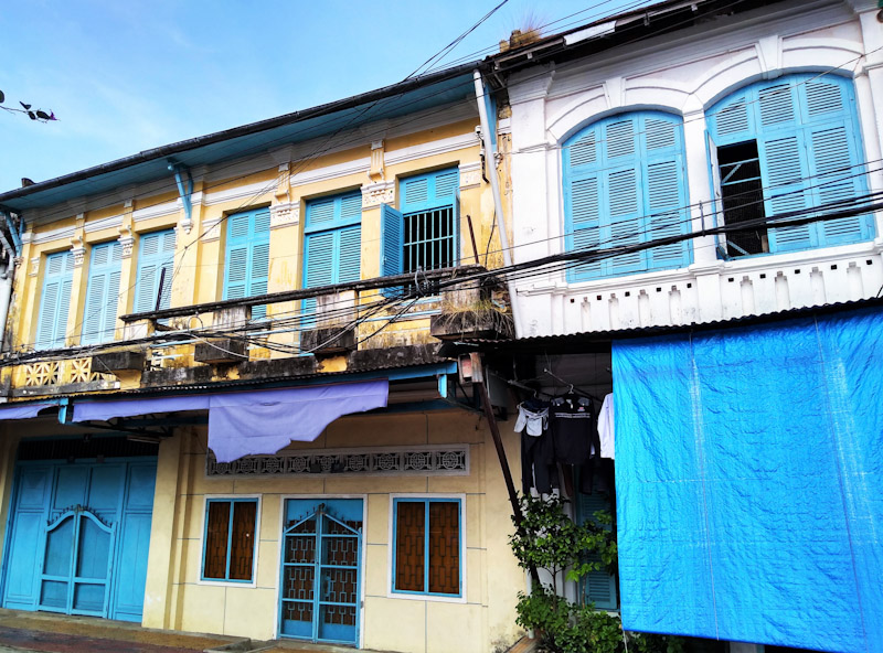 Colonial shop houses pained in yellow, white and blue on the waterfront near Sa Dec. 